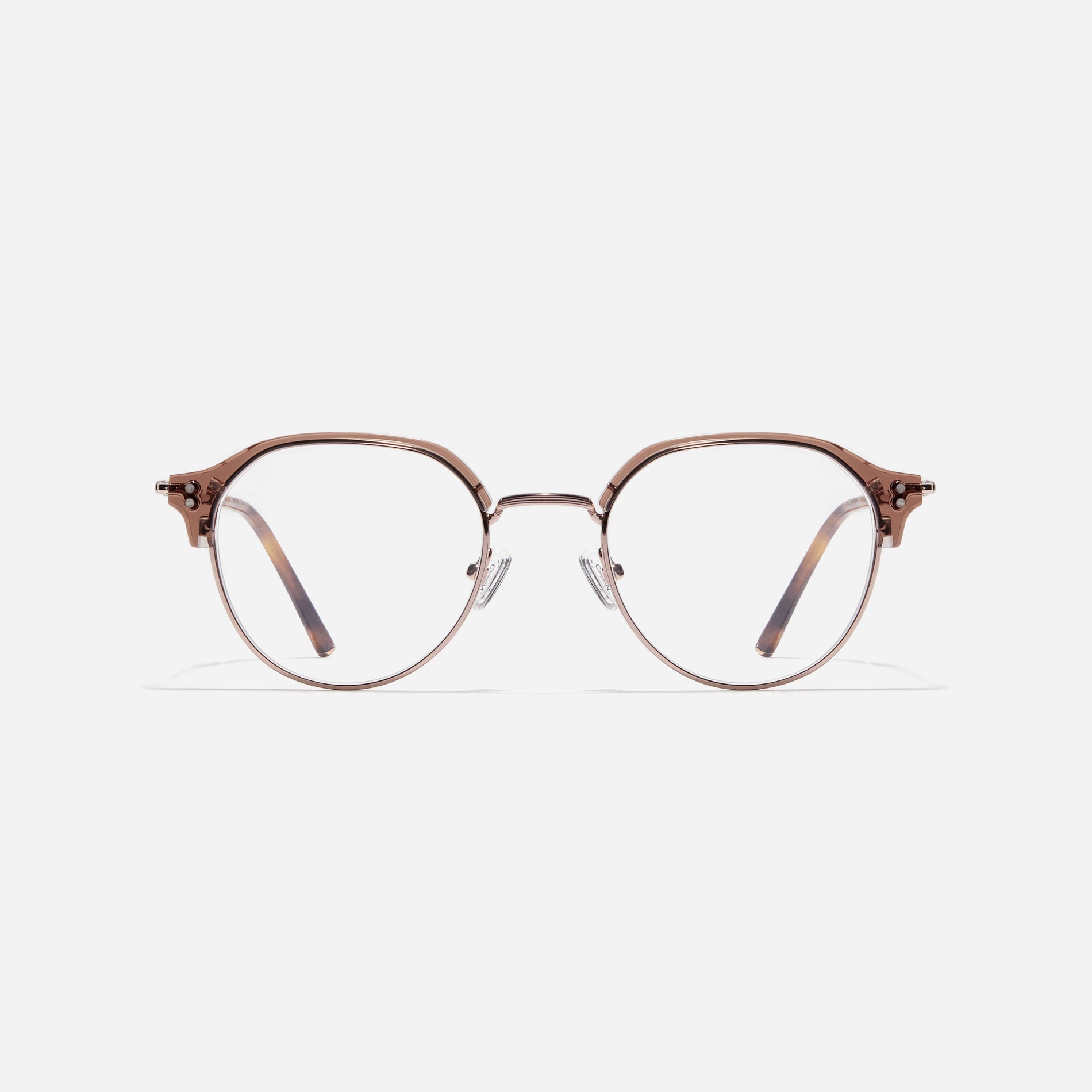 Polygonal-shaped gold-rimmed eyeglasses. The frame, constructed from bioplastic and titanium, seamlessly merges exceptional durability with an ultra-lightweight build, while stylish nose bridge lining details enhance the overall design. The B-titanium temples deliver a lightweight and comfortable fit, guaranteeing prolonged wear without any discomfort.