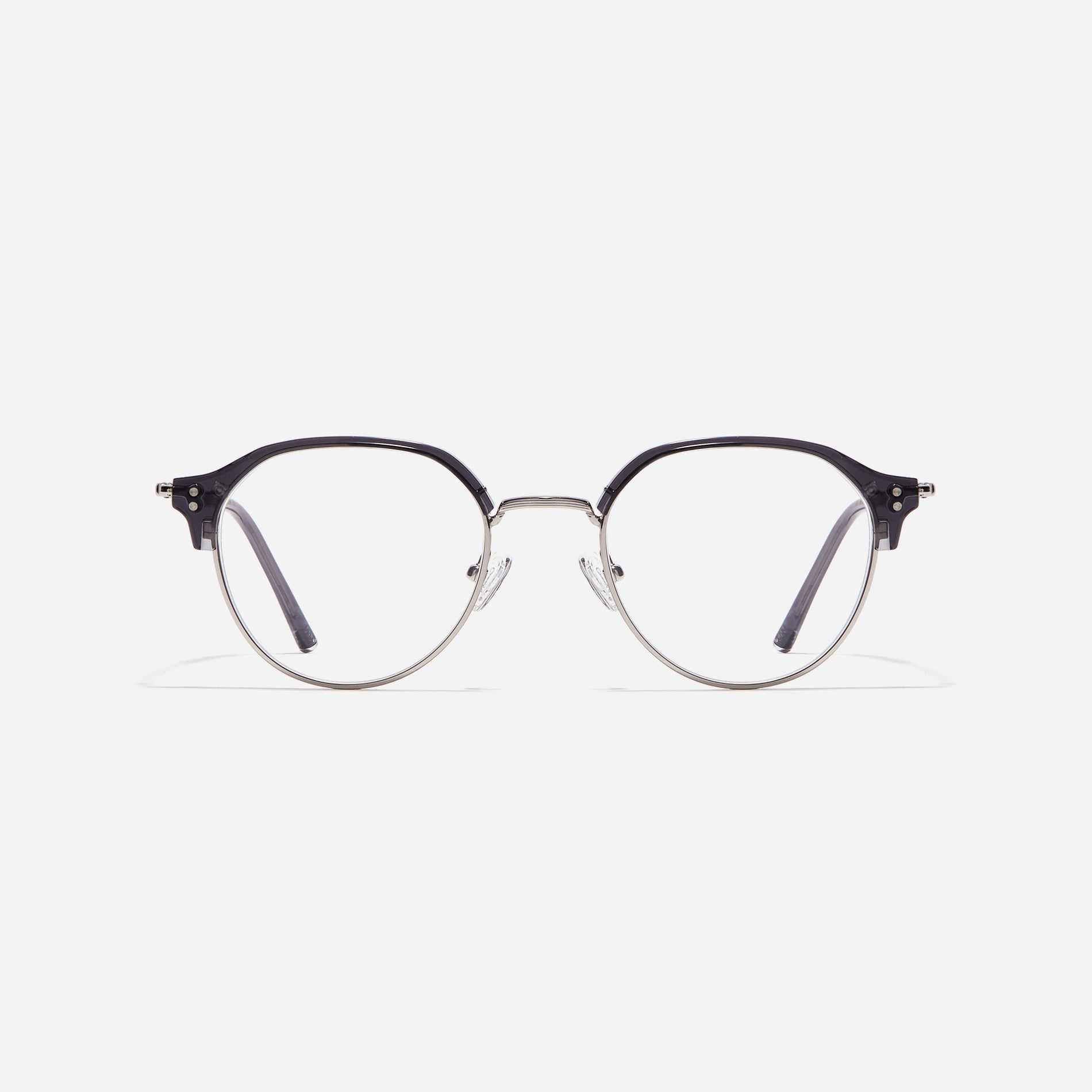 Polygonal-shaped gold-rimmed eyeglasses. The frame, constructed from bioplastic and titanium, seamlessly merges exceptional durability with an ultra-lightweight build, while stylish nose bridge lining details enhance the overall design. The B-titanium temples deliver a lightweight and comfortable fit, guaranteeing prolonged wear without any discomfort.