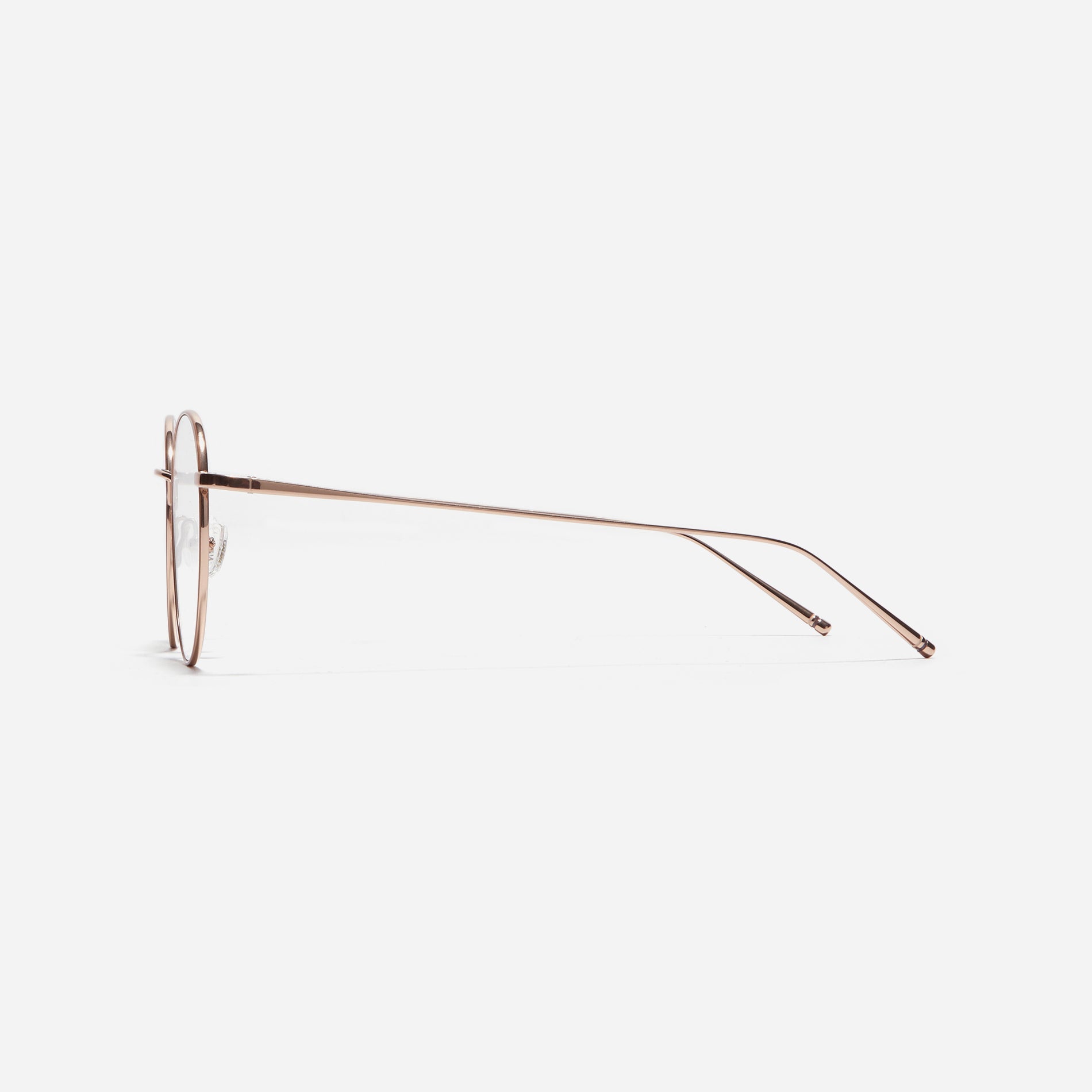 Round-shaped eyeglasses that naturally complement all face shapes. Crafted entirely from titanium, the frame provides exceptional durability and featherweight comfort, while its design adds a touch of casual charm to one's daily style.