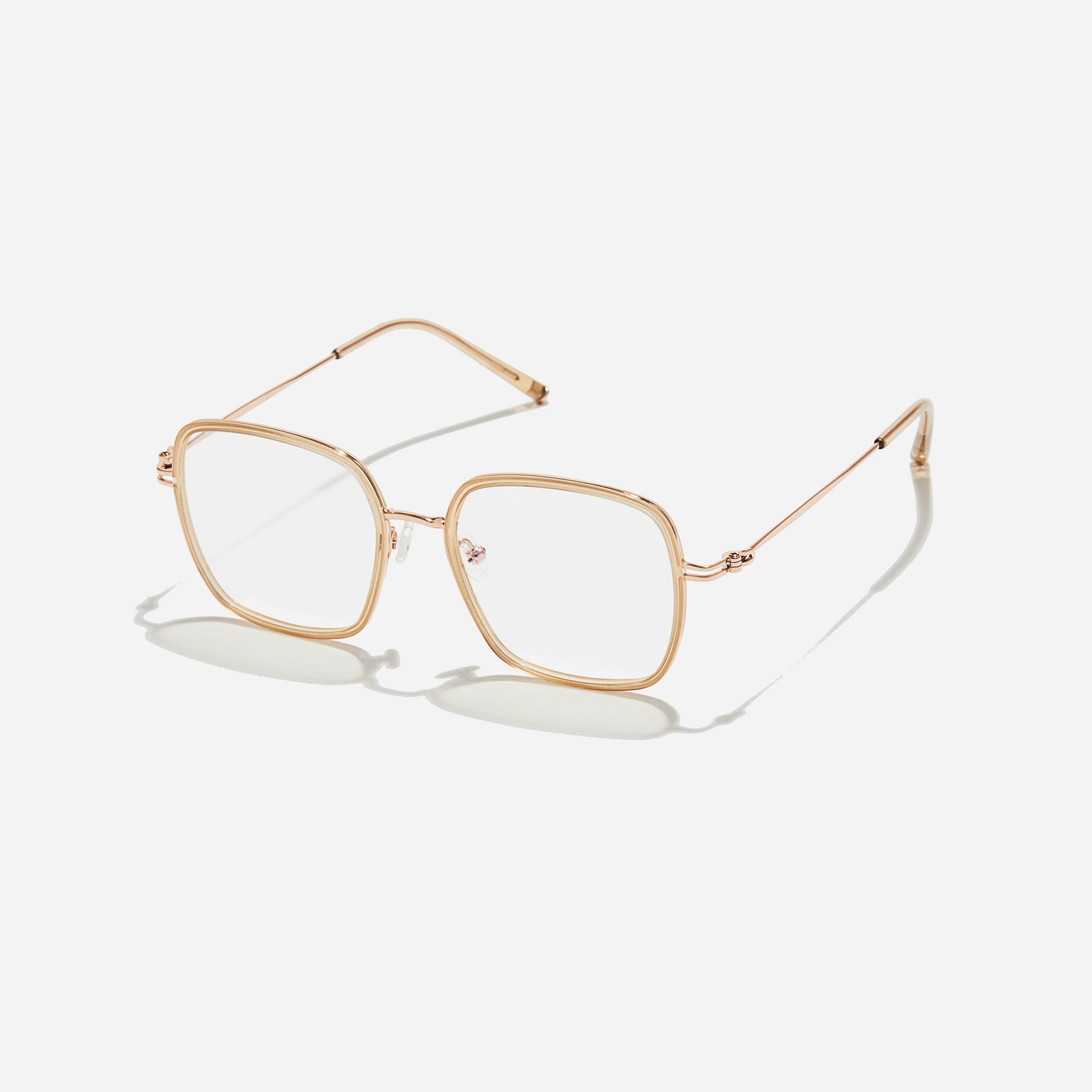 Rectangular-shaped oversized eyeglasses characterized by a delicate acetate rim that secures the frame and hinge details. The slim temples, made from lightweight and elastic B-Titanium material, ensure a consistently comfortable fit.