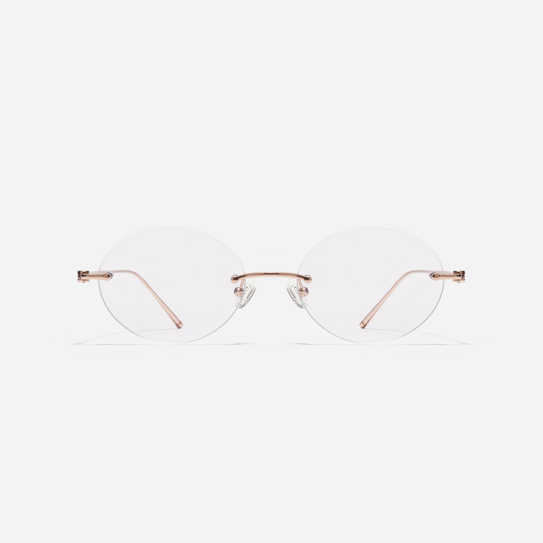 Rimless round-shaped retro eyeglasses. Featuring narrow rims and dual lining on the tips, these eyeglasses ensure a consistently comfortable fit and prevent slipping.