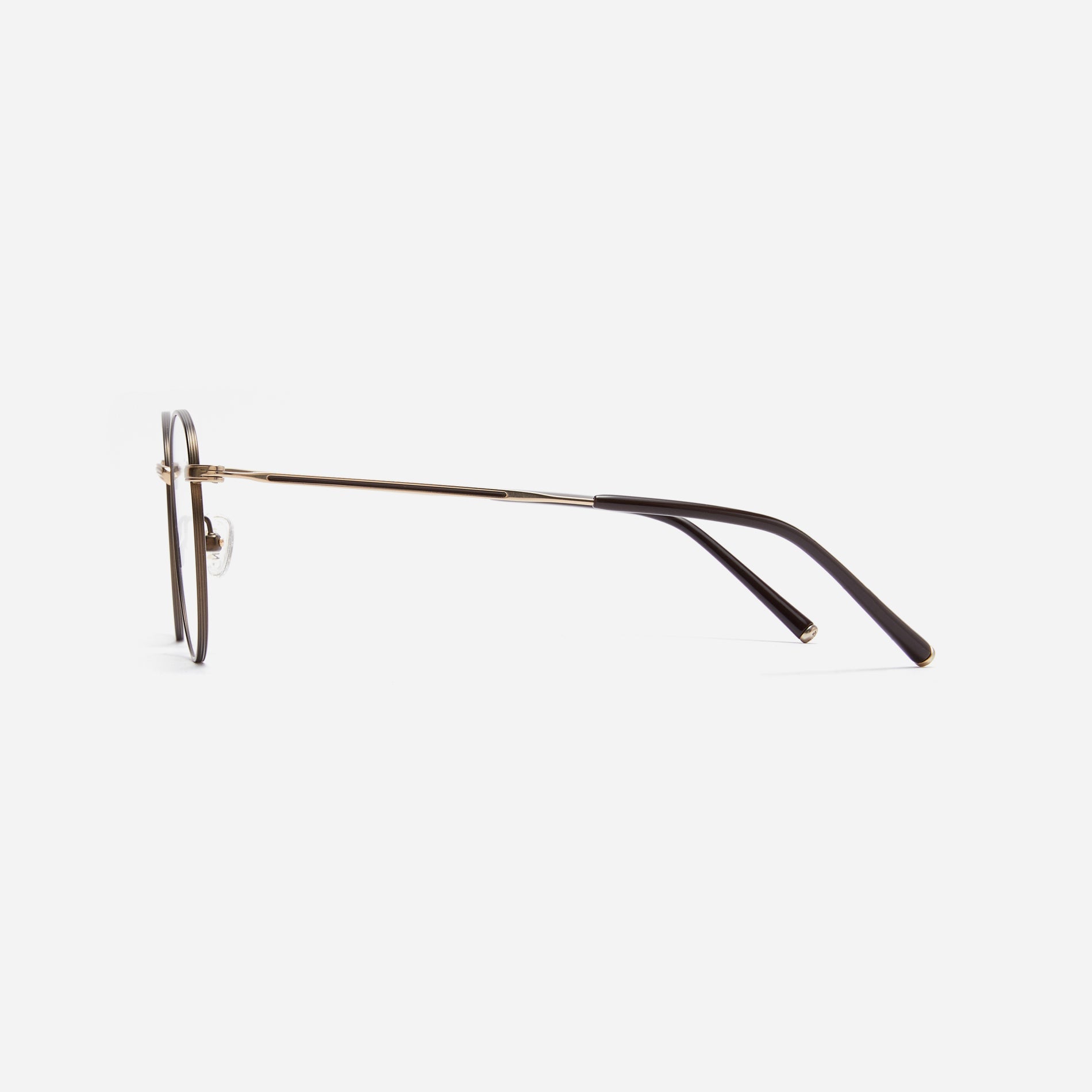 Round-shaped blue light blocking eyeglasses. Crafted entirely from pure titanium, they offer a lightweight and comfortable wearing experience.  The three-dimensional lining details on the frame and temples, combined with epoxy and matte plating, enhance its classic ambiance. 