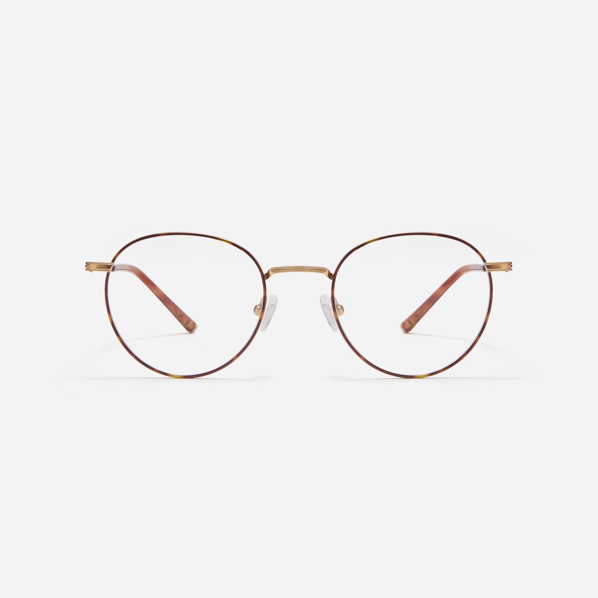 Round-shaped blue light blocking eyeglasses. Crafted entirely from pure titanium, they offer a lightweight and comfortable wearing experience.  The three-dimensional lining details on the frame and temples, combined with epoxy and matte plating, enhance its classic ambiance. 