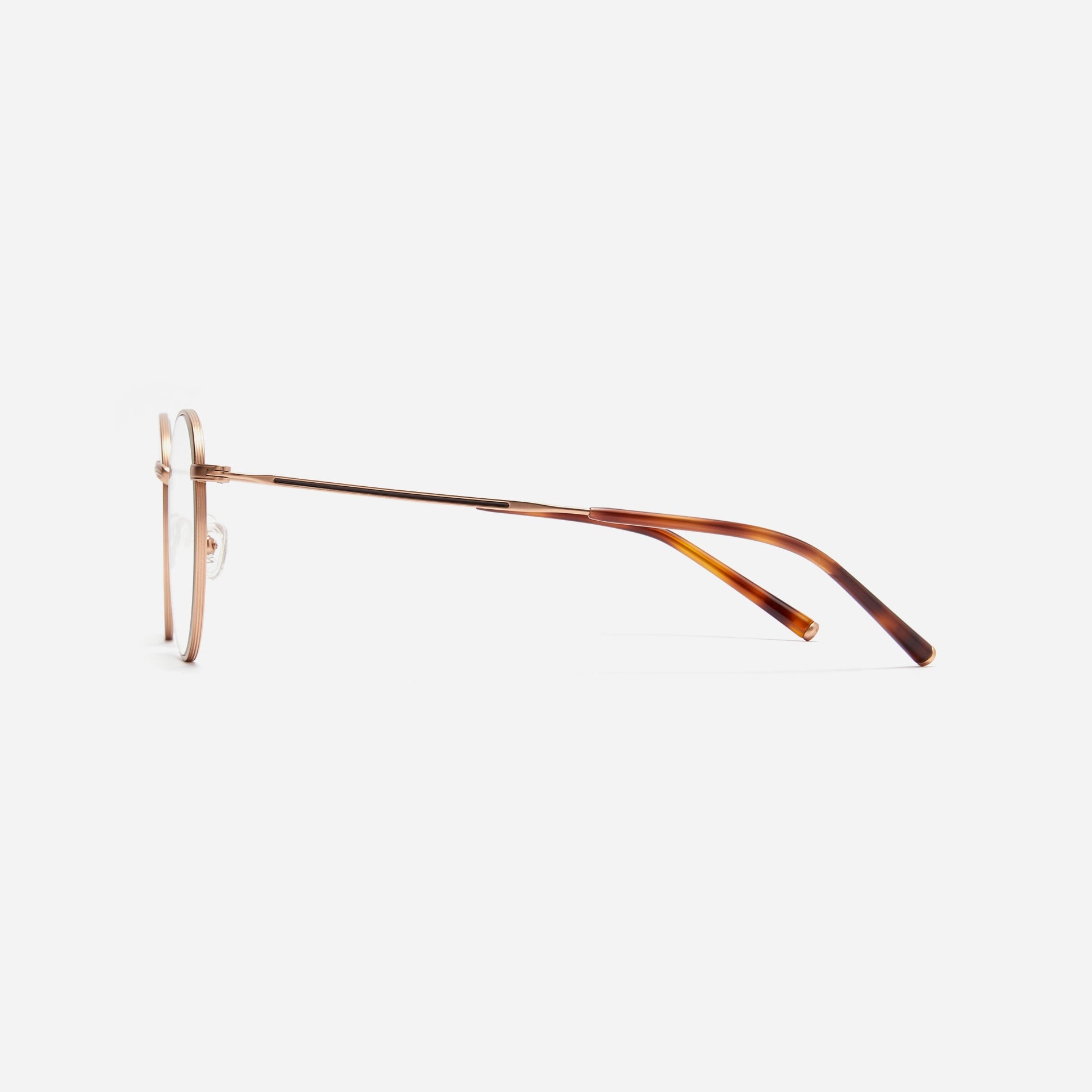 Round-shaped blue light blocking eyeglasses. Crafted entirely from pure titanium, they offer a lightweight and comfortable wearing experience.  The three-dimensional lining details on the frame and temples, combined with epoxy and matte plating, enhance its classic ambiance. 
