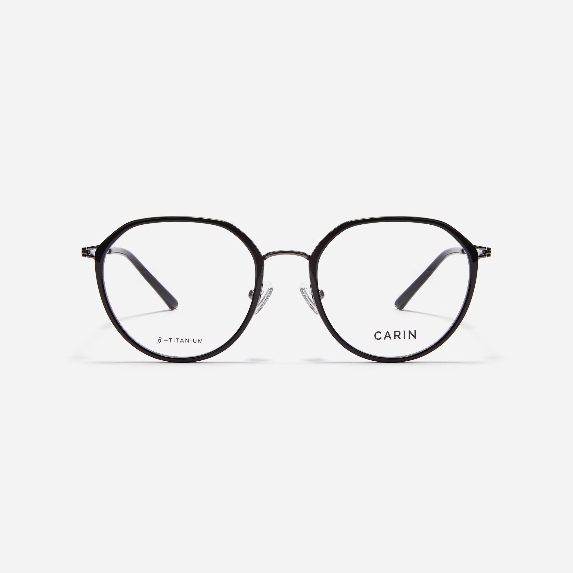 Combination eyeglasses featuring a harmonious blend of a polygonal lens shape and an acetate frame. These eyeglasses are characterized by a delicate acetate rim that secures the frame and hinge details. The slim temples, made from lightweight and elastic B-Titanium material, ensure a consistently comfortable fit.