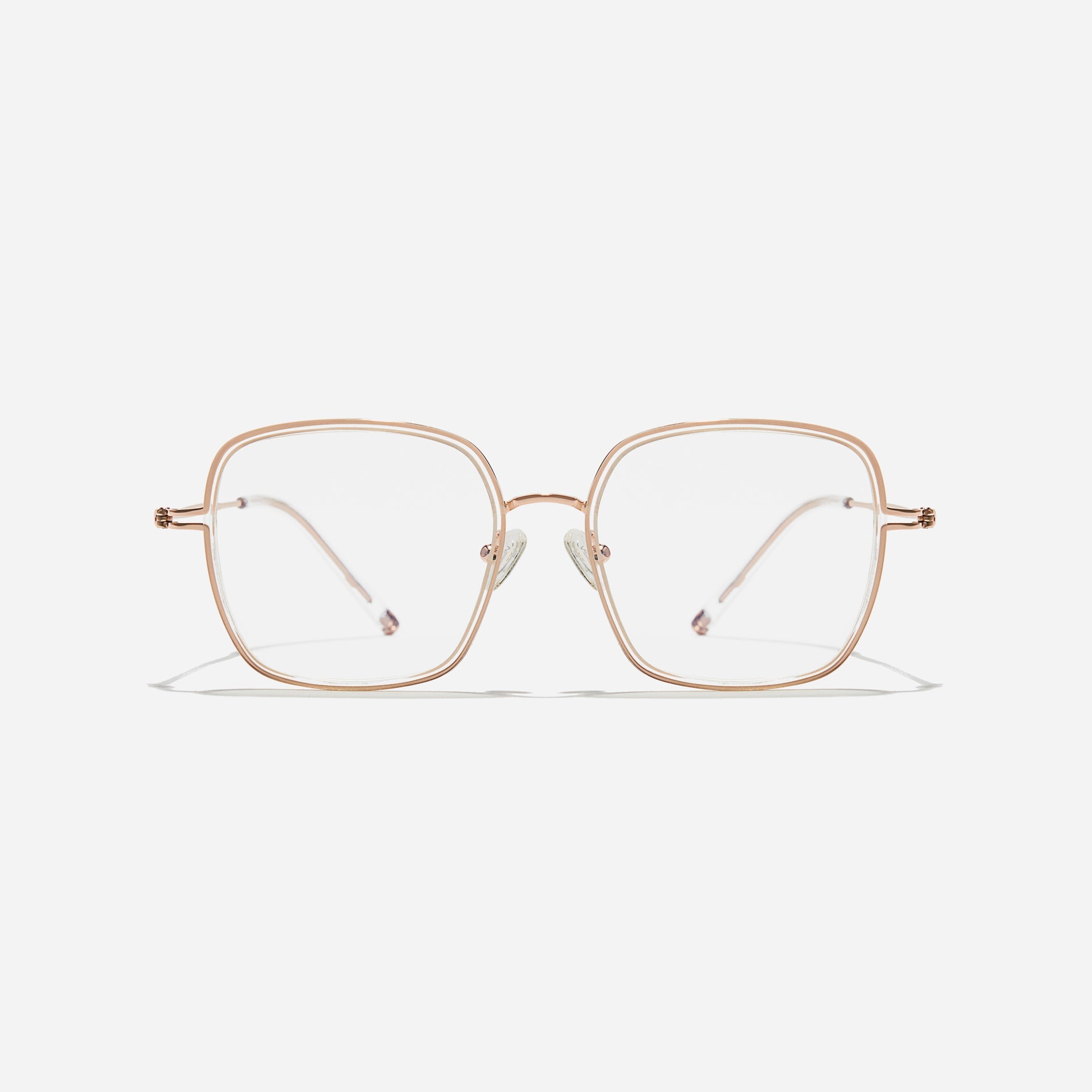 Rectangular-shaped oversized eyeglasses  characterized by a delicate acetate rim that secures the frame and hinge details.  The slim temples, made from lightweight and elastic B-Titanium material, ensure a consistently comfortable fit.