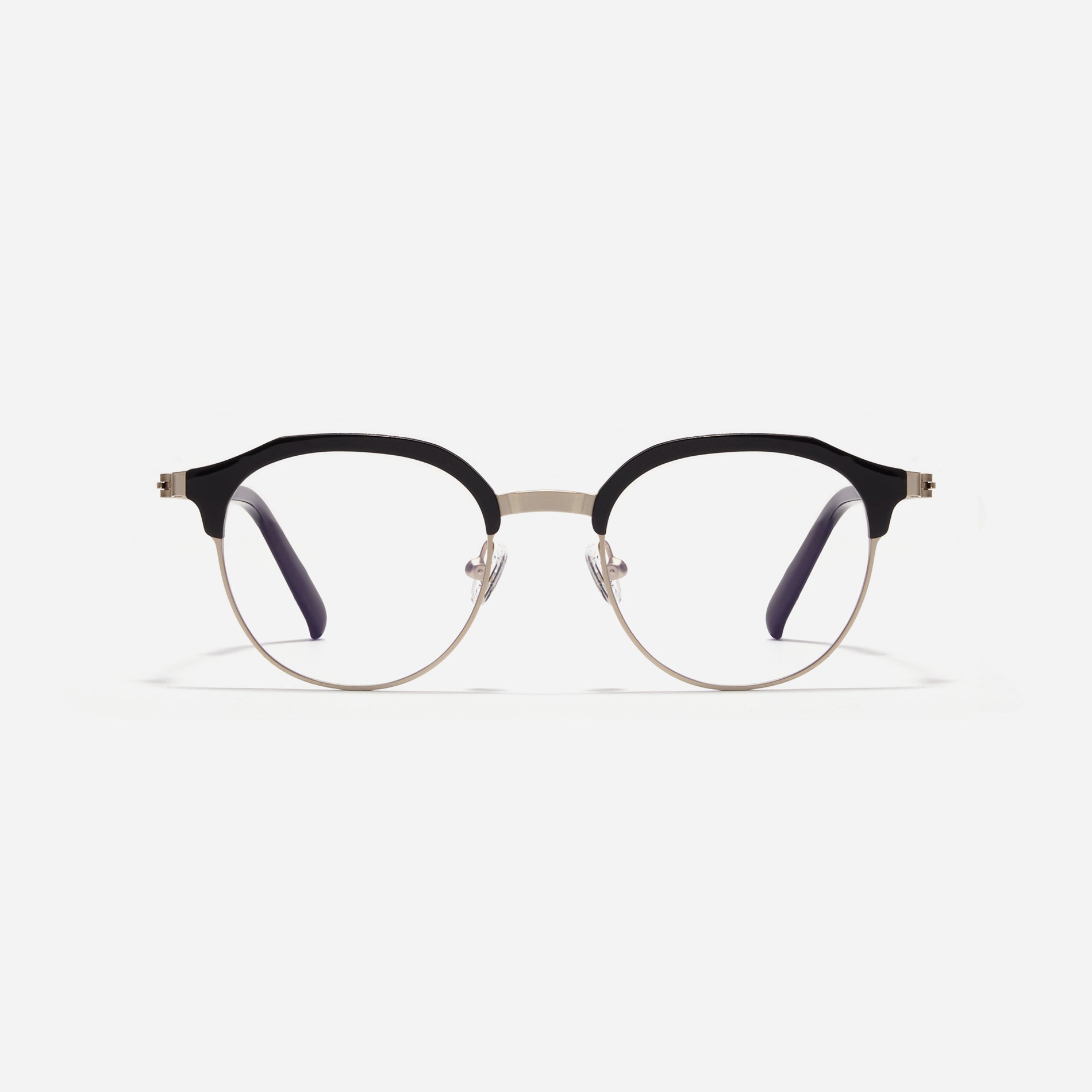 Lightweight polygon-shaped eyeglasses from CARIN's 'Feather Fit' line, offering a contemporary twist on the classic browline design. 